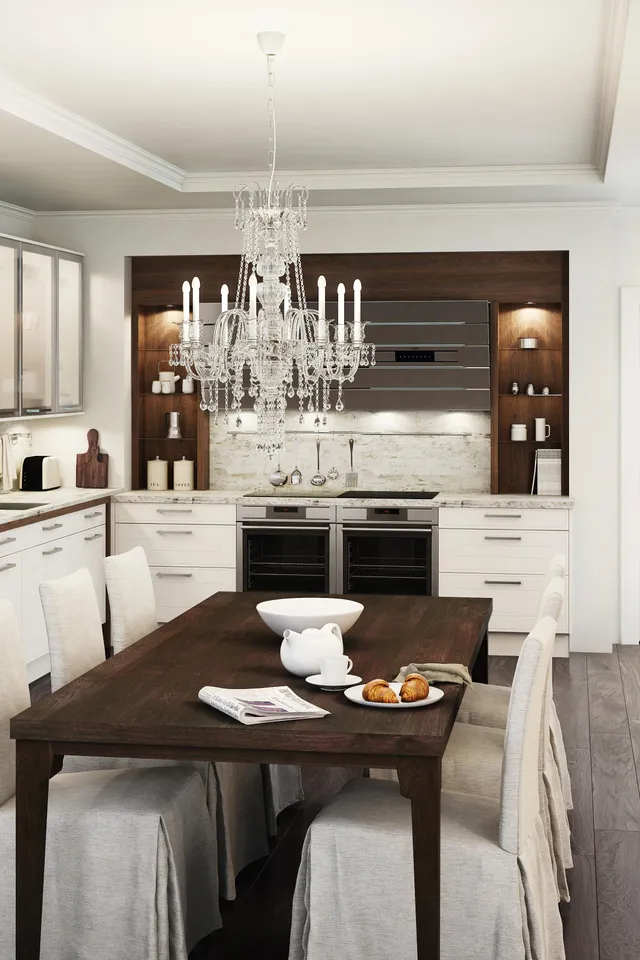 Moderne weiße Küche mit Holzakzenten, Kronleuchter und Esstisch mit gedecktem Frühstück